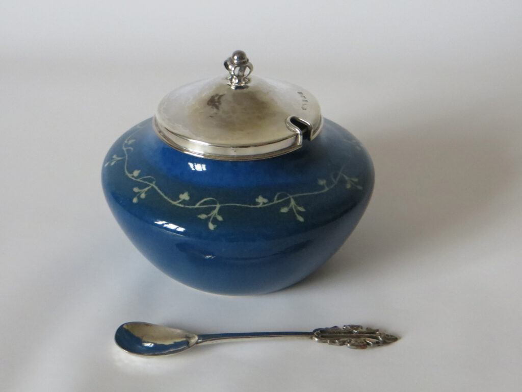 1921 Ruskin jam pot in the popular 'Chrome 11' glaze with A. E. Jones mounts.