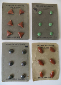 Ruskin buttons on factory cards.