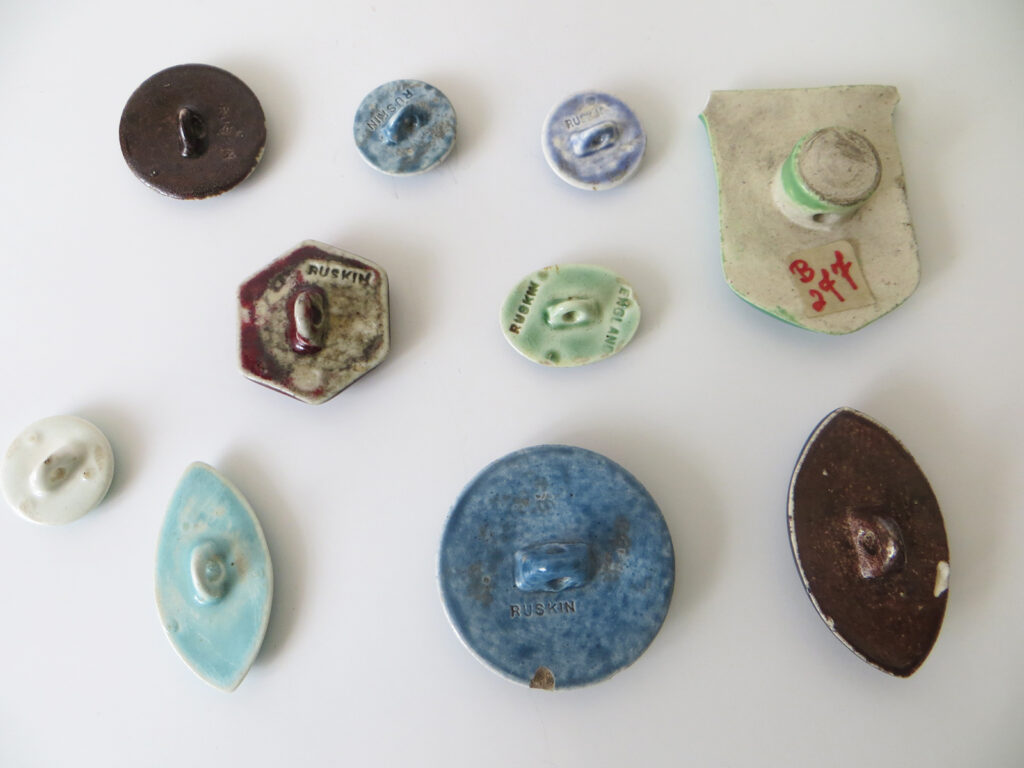 Ruskin enamel buttons, various shapes.