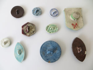 Ruskin enamel buttons, various shapes.