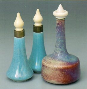 Pair of lustre scents and high fire with ivory tops.